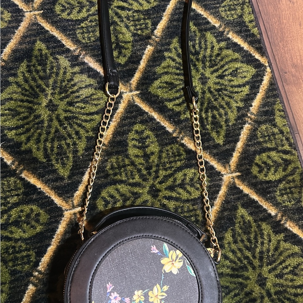 LG Black Round Crossbody Bag with Yellow Floral Accent